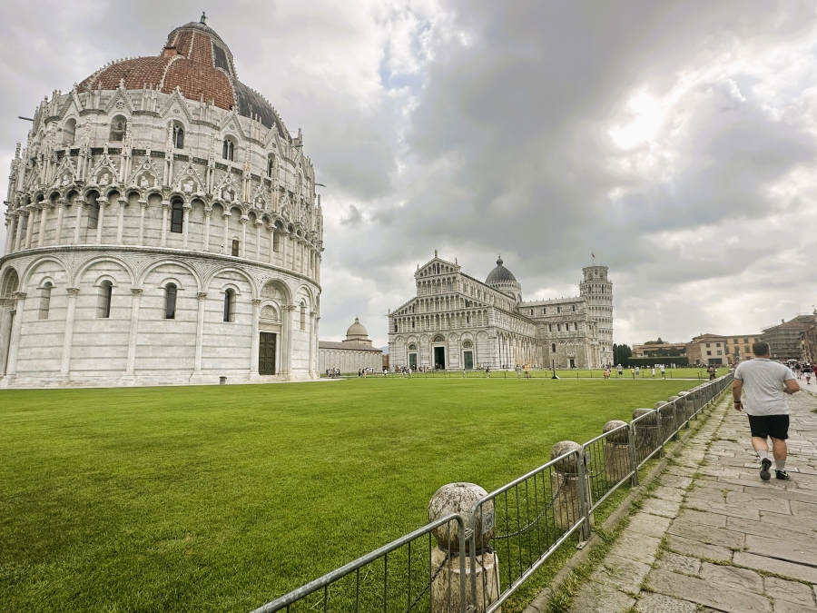 The Baptistery of Pisa with the Cathedral and Leaning Tower in the background at Piazza dei Miracoli, Italy