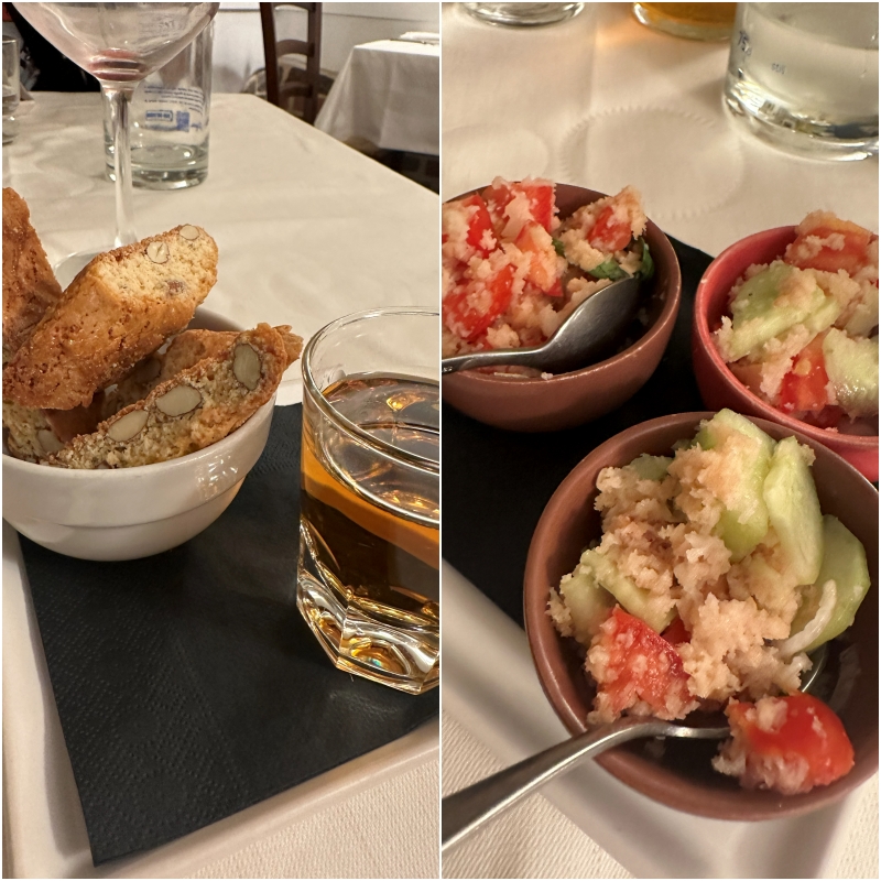 Bowls of panzanella bread salad and cantucci biscuits served with Vin Santo, a classic Tuscan meal found in Pisa and Florence