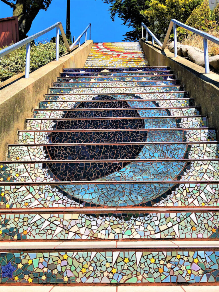 Moon and Sun mosaics tiled steps towards the top of the 16th Avenue Tiled Steps