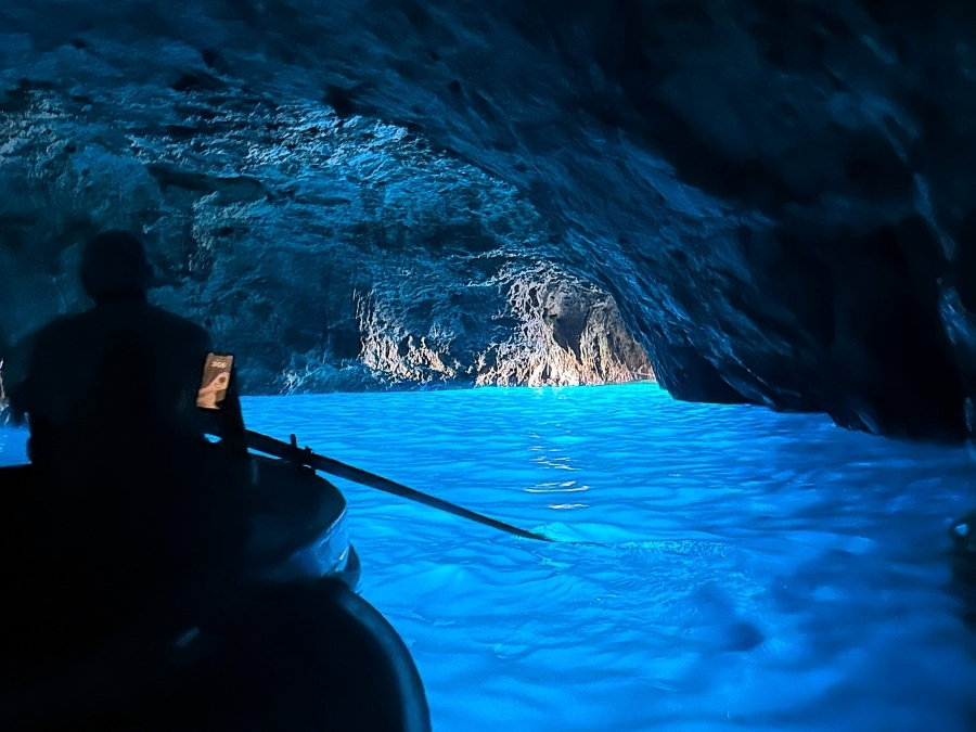 Blue Grotto Capri — the famous sea cave glowing with electric blue light, often combined with a visit to Villa San Michele.